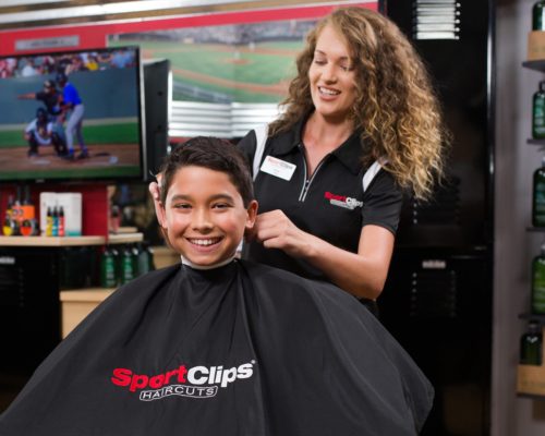 SportsClips hairdresser with client in barber chair Blakeney Town Center Charlotte, NC